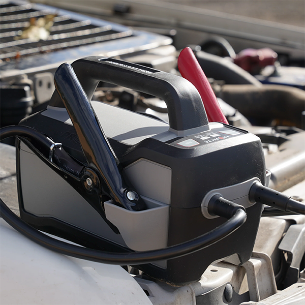 Projecta IS1500 Lithium Jump Starter connected to car battery