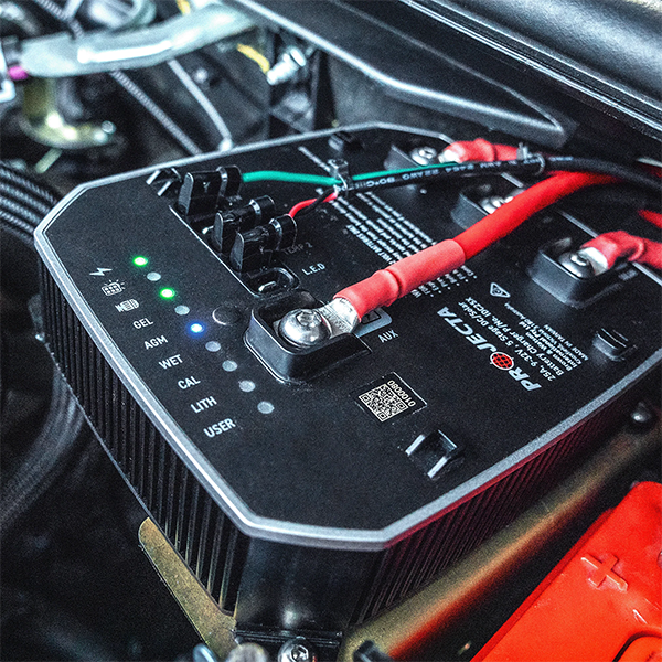 Projecta IDC25XIQ DCDC  with connections inside a vehicle's engine compartment.