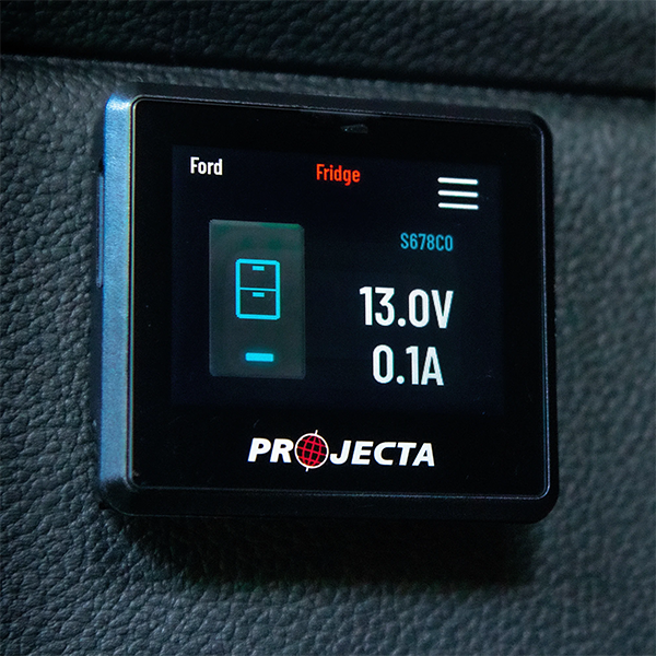 Projecta IDC25XIQ DCDC digital display showing voltage and current on a dark textured surface
