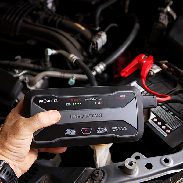 Projecta IS920C Jump Starter with clamps connected to car battery